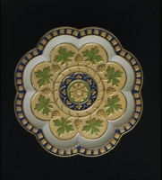 Description: Plate with molded and painted decoration